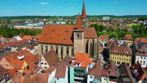 4k aerial drone video of the historic st. johannis church in the old town area of downtown ansbach, germany