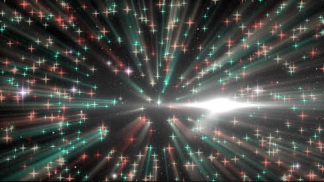 mancha de luz sobre múltiples estrellas que caen contra un fondo negro