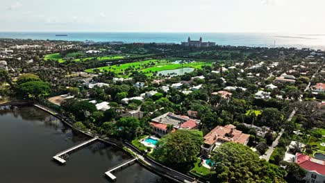 aerial: municipal beach golf course near atlantic ocean during the day in west palm beach, florida, usa, establishing drone shot