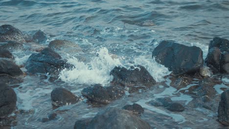 Waves-crashing-over-rocky-coastal-shoreline-Lesvos-island,-Greece