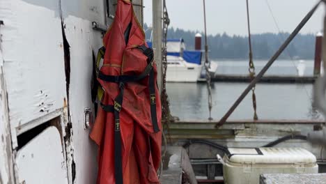 fishing jumpsuit hanging in a trawler in florence, oregon