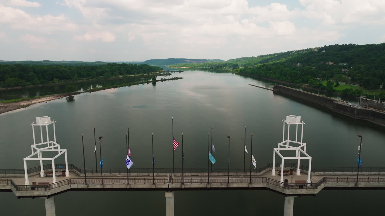 Big Dam hydroelectric infrastructure over Arkansas River, near Cook's Landing Park, North Little Rock, Arkansas, USA - Aerial reveal dolly backward