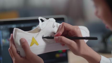 person designing custom shoes