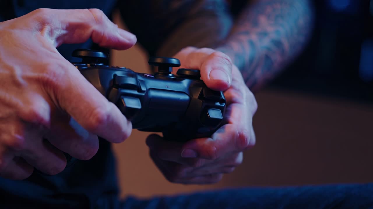 Close-up shot of hands gripping a video game controller, highlighting intense focus