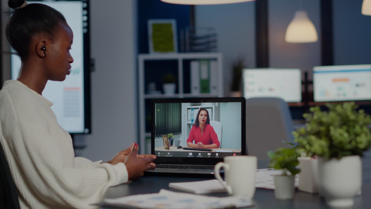 African businesswoman discussing with remotely woman partner