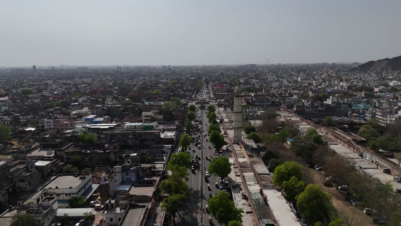 High-angle shot of the dense, maze-like residential areas surrounding a hilltop fort.