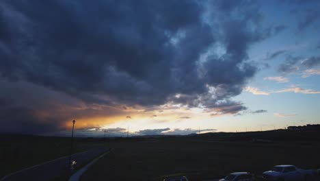 beautiful clouds rolling past the sunset at the edge of the alberta foothill suburbs in the fall; static shot 1080p