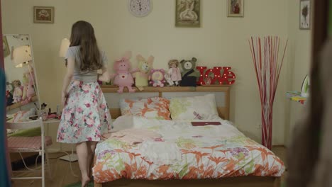 woman getting dressed in a bedroom