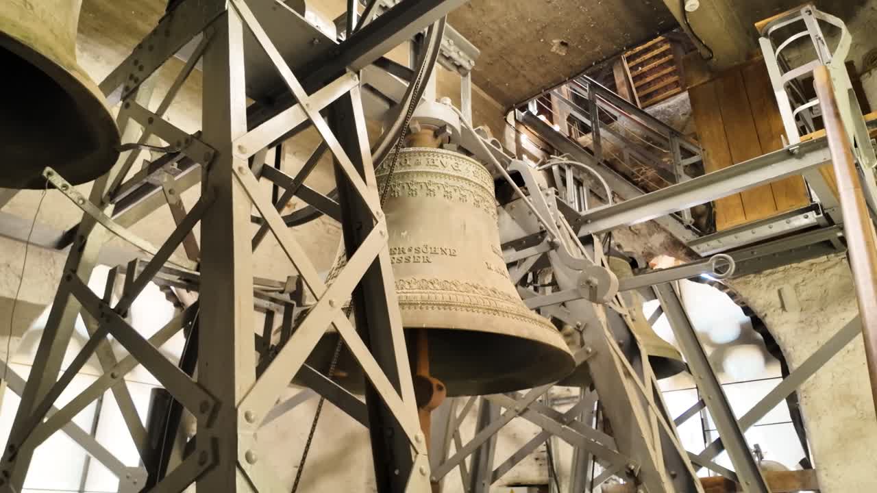 Clock tower bells inside the Lutheran Cathedral of Saint Mary in Sibiu, showcasing intricate mechanics and historic architecture