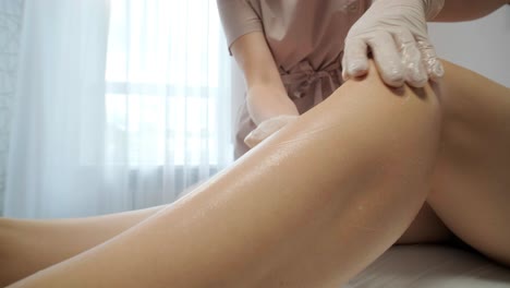 laser epilation - hair removal procedure. flash of diode laser hair removal, beautician removes hair on beautiful female legs, hair removal for smooth skin, laser procedure at beauty studio or clinic, body care epilation treatment.