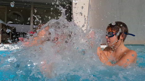 Family-splashing-water-in-pool