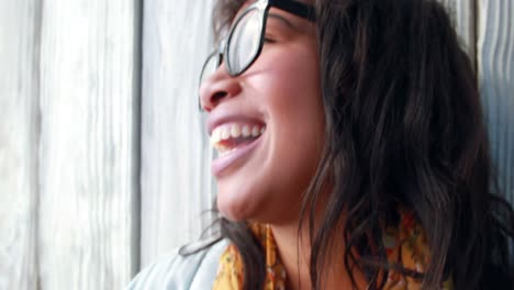 Smiling-hipster-woman-playing-guitar