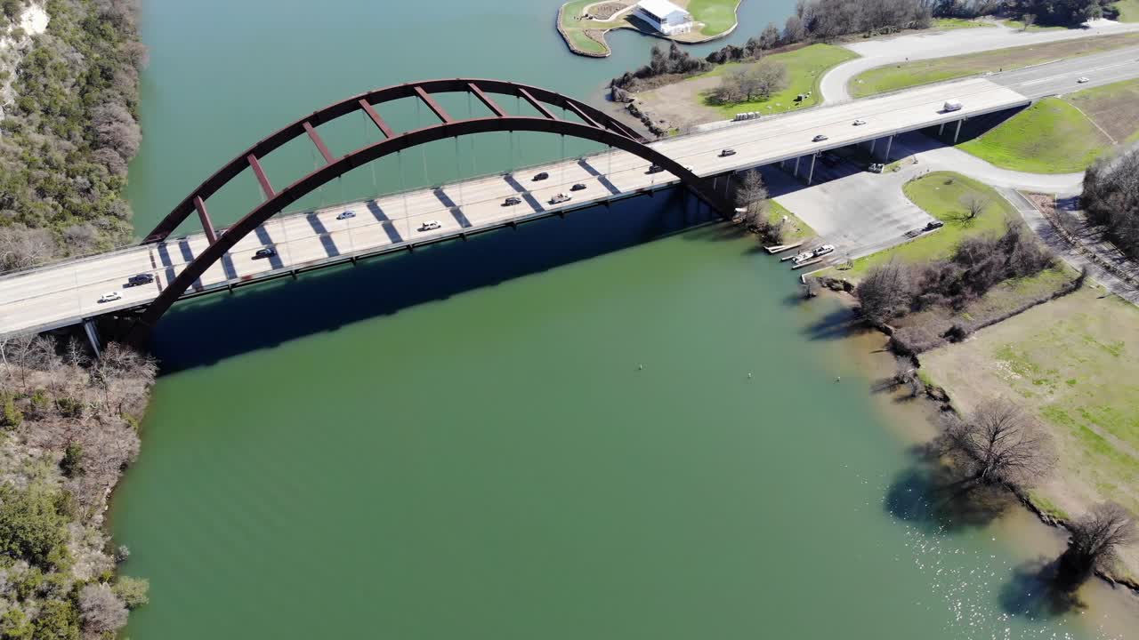 Aerial Austin Pennybacker Bridge - moving towards bridge set diagonally, higher altitude, bridge and river filling the frame with no sky included