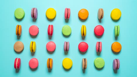 macarons moving stop motion. top view with multi-colored macarons.