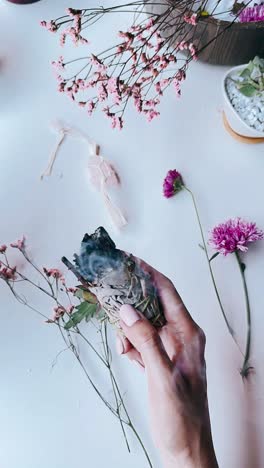 smudging with white sage and flowers