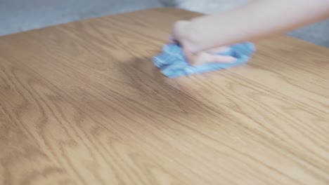 cleaning table with a wet cloth