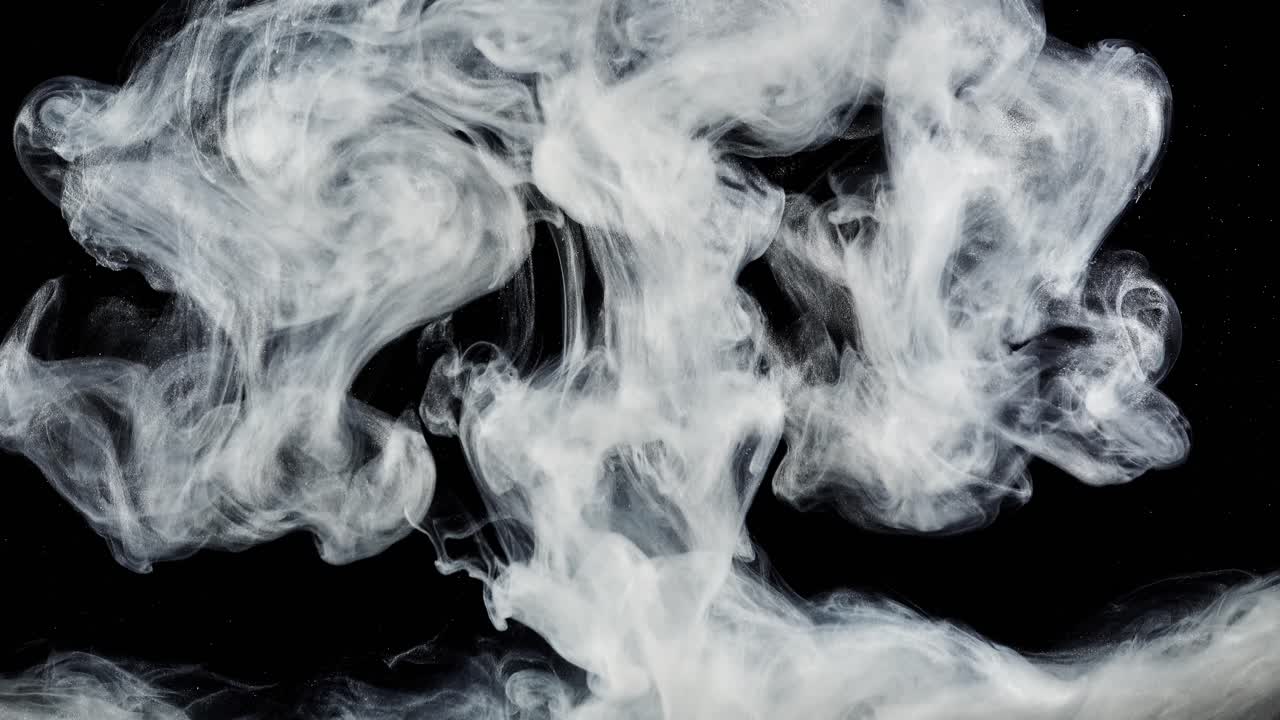Forme astratte. Riprese su sfondo nero. Mescolanza di colori