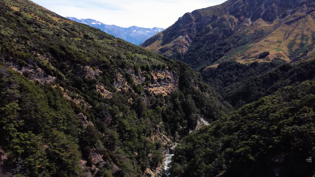 AERIAL Descending Shot of a Stunning River Valley in the Mountains of South Island, New Zealand