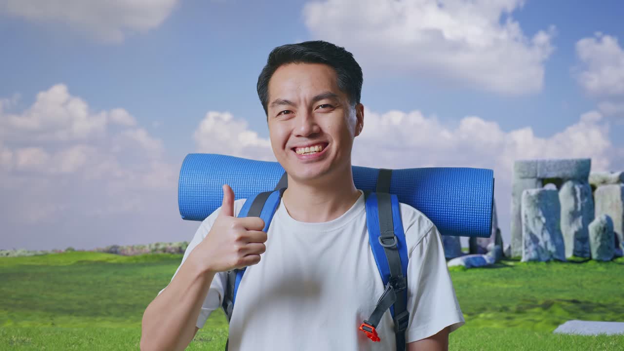 Happy Traveler with Thumbs Up in Front of Stonehenge