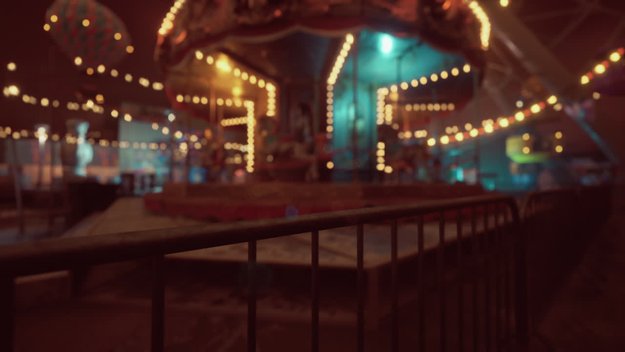 An empty and quiet amusement park with twinkling lights at dusk
