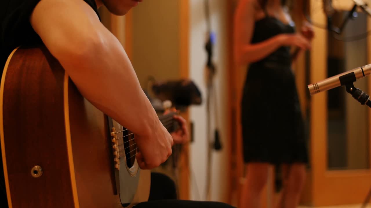 Music band performing in a studio