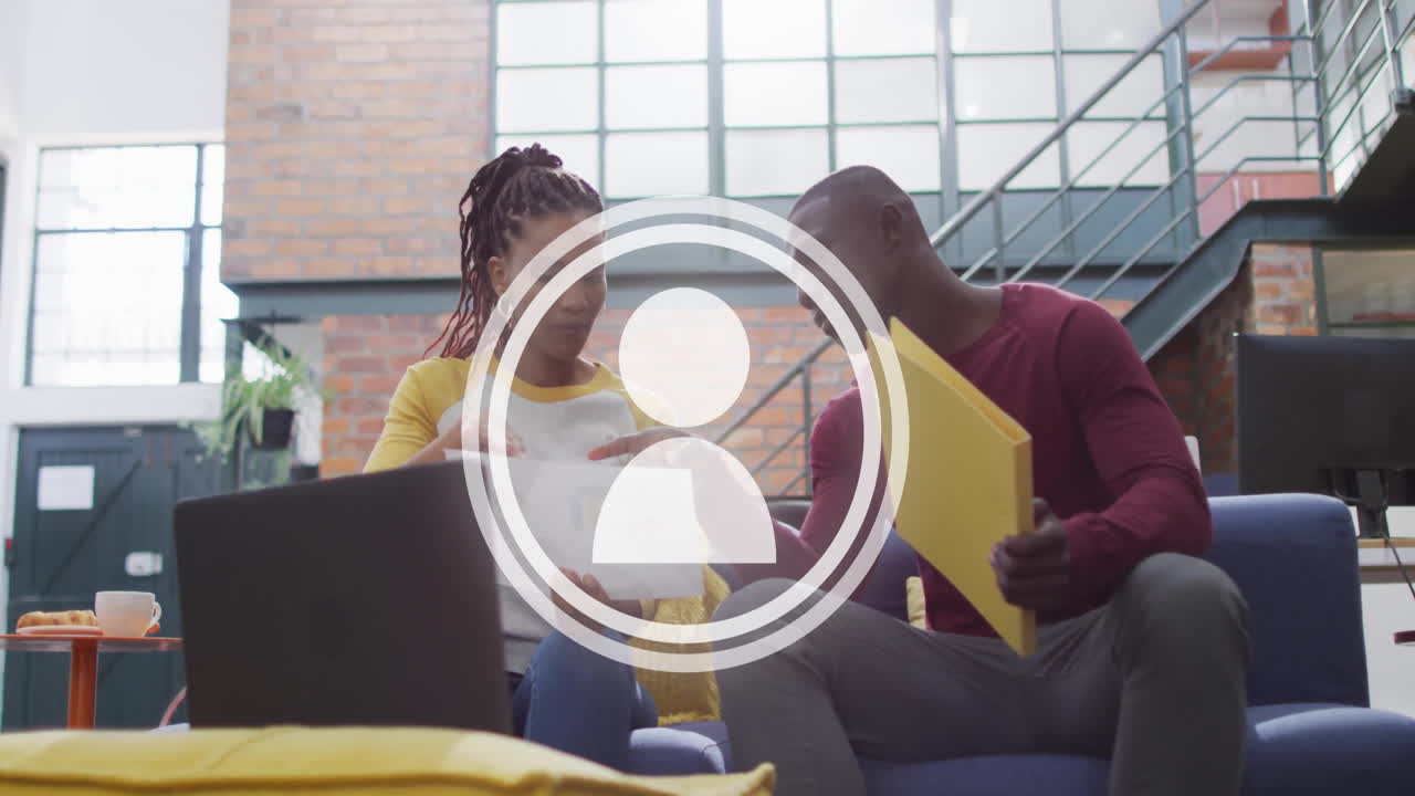 Discussing documents, two people in modern office with animation of user icon