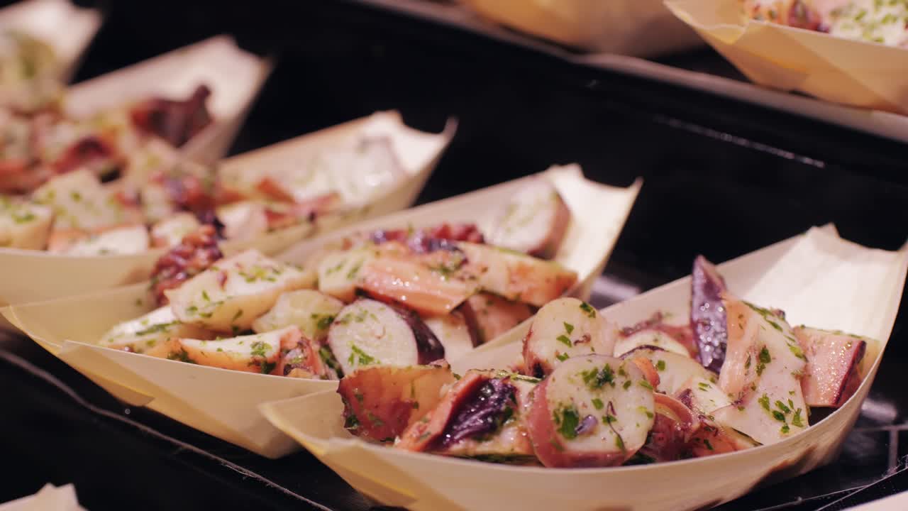 Savor a tasty seafood salad with herbs in bamboo boats at a stylish upscale restaurant, beautifully presented