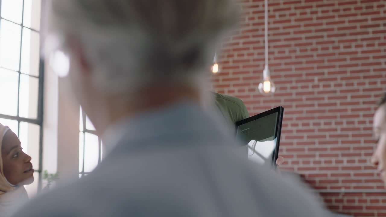 diverse business women meeting brainstorming team leader sharing creative ideas for startup project presenting using tablet computer collaborating in modern office presentation