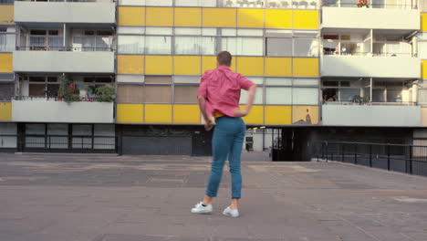 contemporary funky caucasian man street dancer dancing freestyle in the city