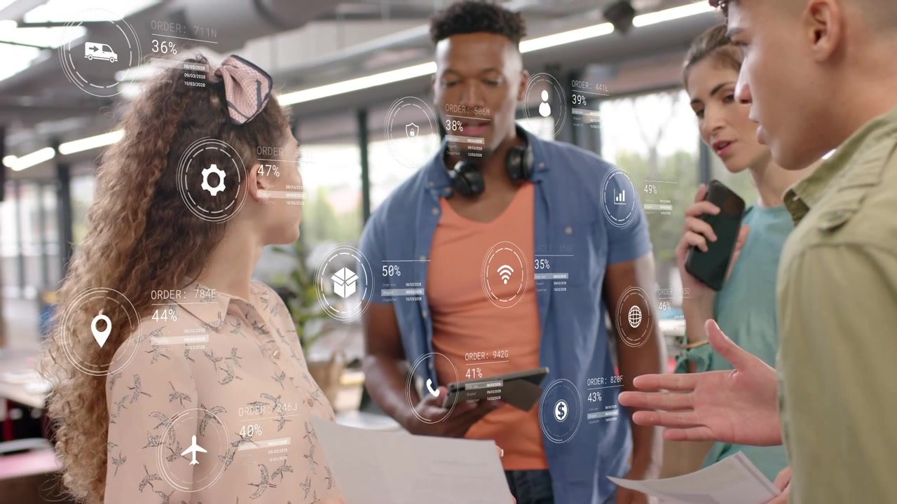 Mid-30s presenter presenting prints gesturing and leading group while activating tech data overlay
