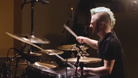 drummer performing in a studio setting