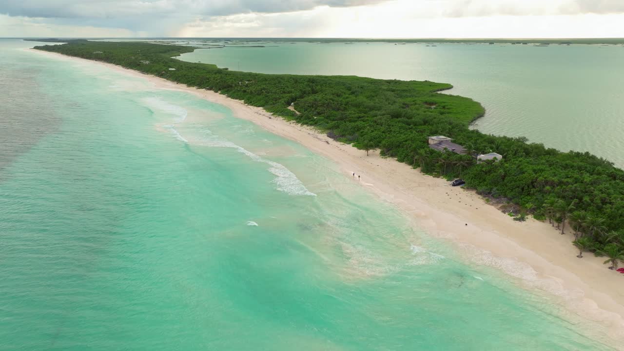 Tulum beach establishing shot, Aerial drone fly oceanfront getaway in México, latin america