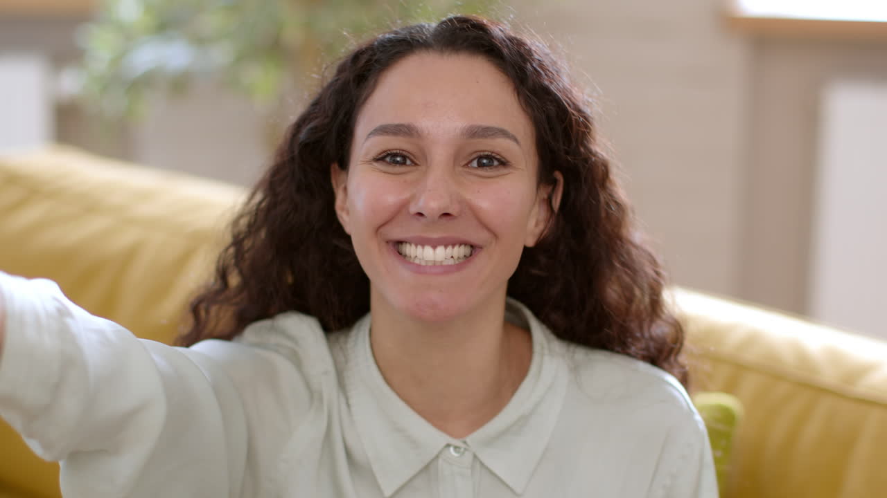 Woman smiling and making a selfie