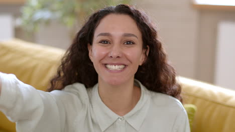 woman smiling and making a selfie