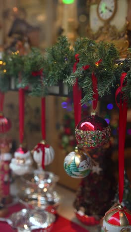 christmas window display with ornaments and decorations