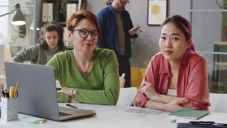 Portrait-of-Multiethnic-Businesswoman-and-Female-Trainee-in-Office