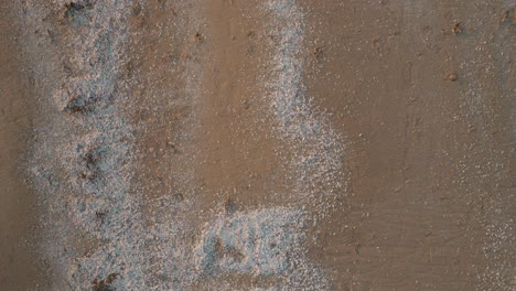 Waves-gently-wash-over-the-sandy-shore-at-Lake-Huron-during-sunset-in-Canada