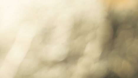 gold abstract blurred christmas lights bokeh background texture in 4k. 4096x2160 slow motion. 24fps cinema footage