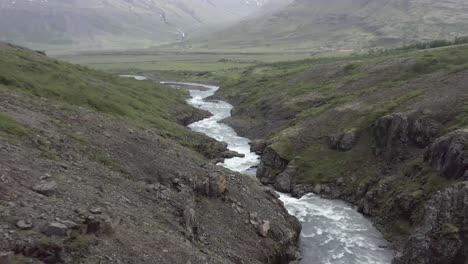 Outlandish-scenery-of-whitewater-rapids-in-rocky-volcanic-landscape-of-Iceland