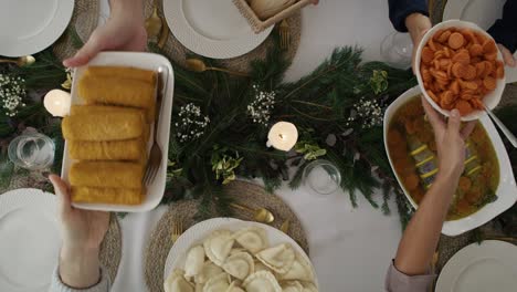 from above family sharing a food during the christmas eve.