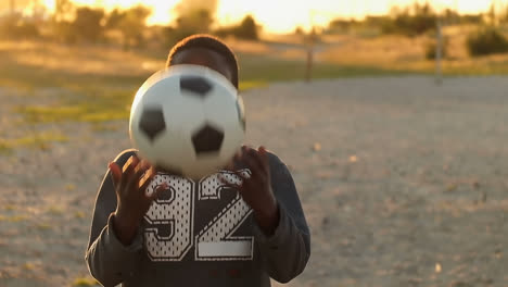 boy alone playing with the football in the ground 4k