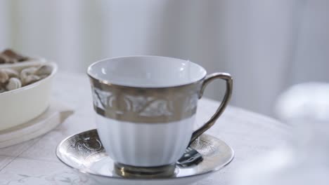 pouring water into a tea cup