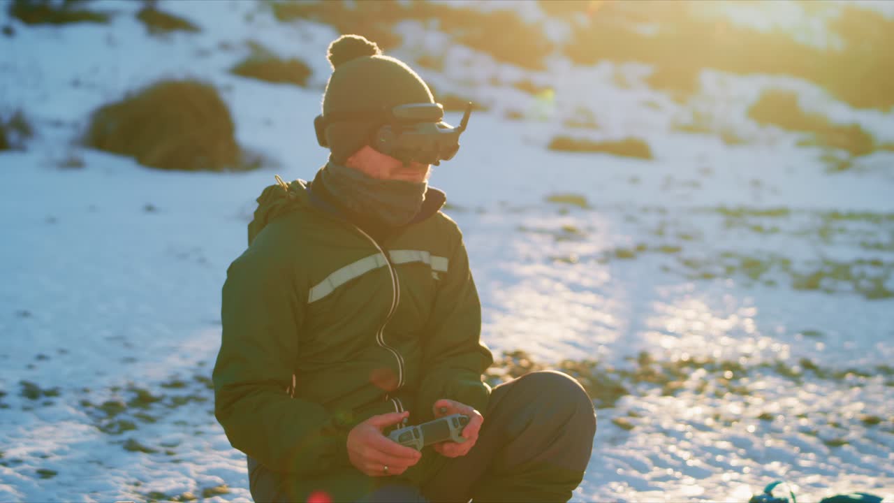 Drone Pilot in Snowy Mountains