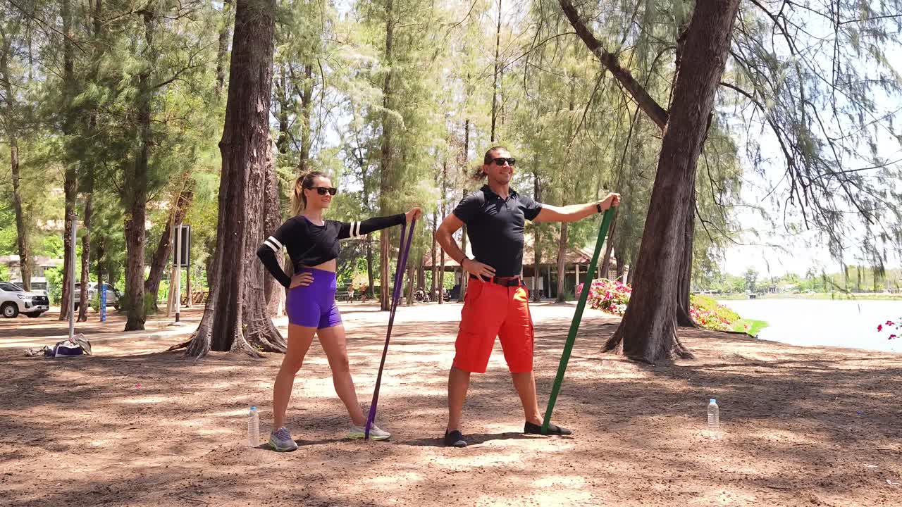Couple Outdoor Workout with Resistance Bands and Poles