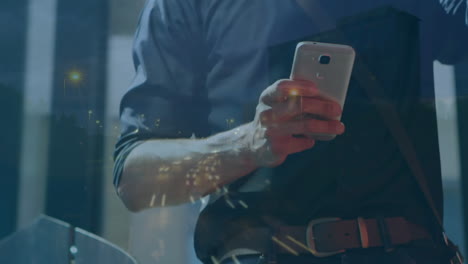 animation of man using smartphone over cityscape