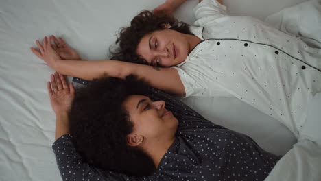 Lovely-couple-laying-on-bed