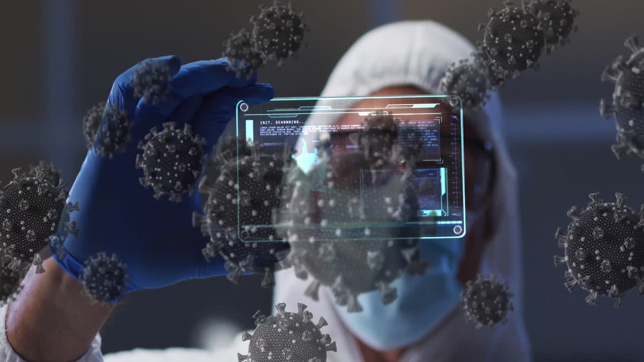 Animation of covid 19 cells over scientist in ppe suit holding screen with medical data processing