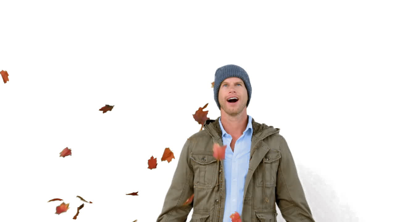 Amazed man looking at falling leaves on white screen