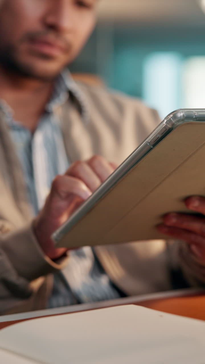 Close-up of Man's Hands Interacting with Digital Tablet