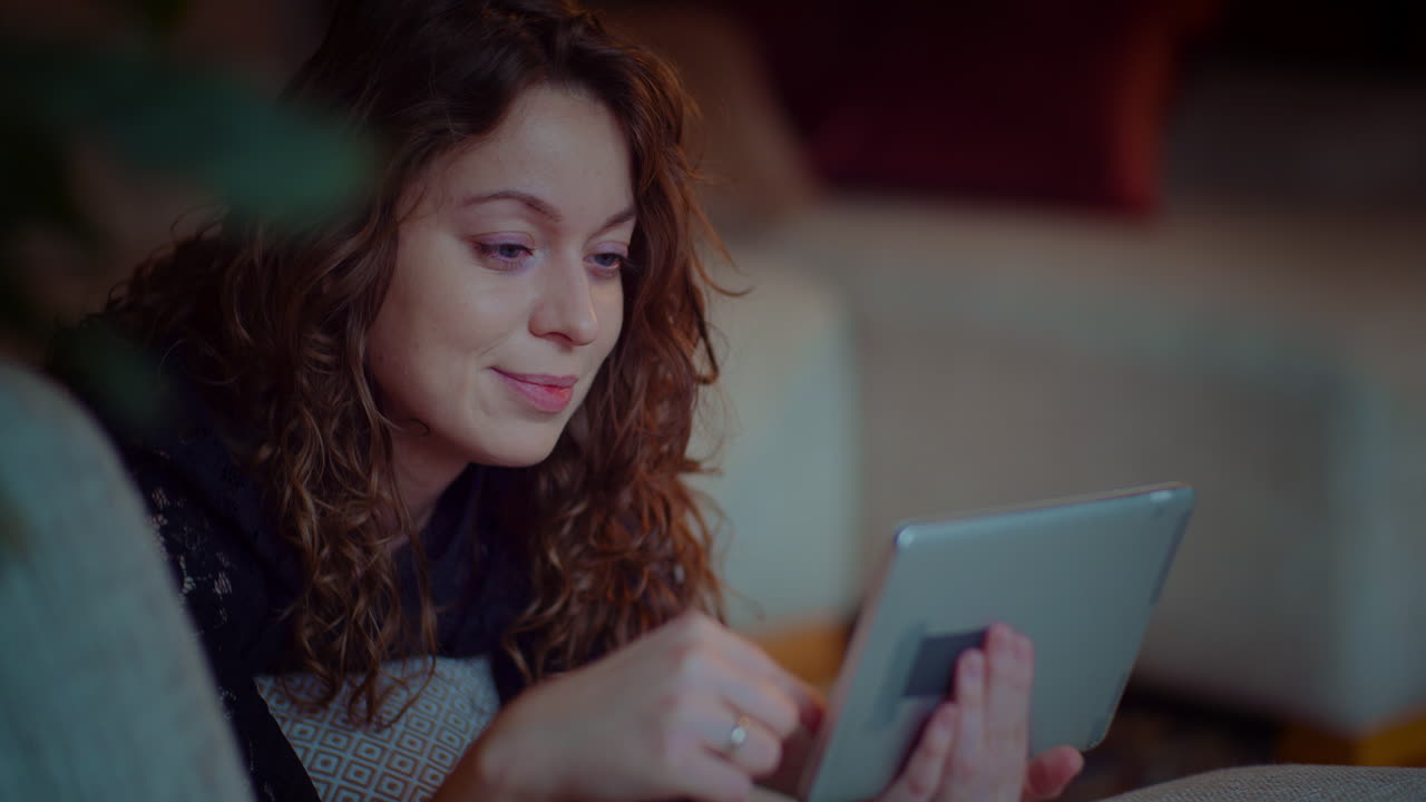 Woman using tablet at home